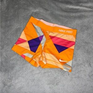 Nike Pro Orange Shorts with Geometric Design